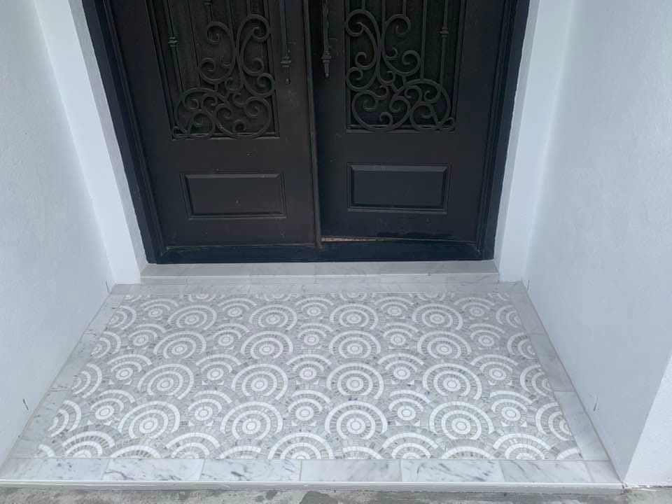 Decorative mosaic tile medallion in entryway floor