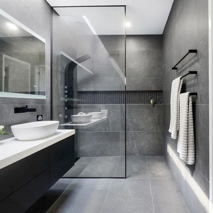 Modern bathroom renovation with tiled shower and vanity