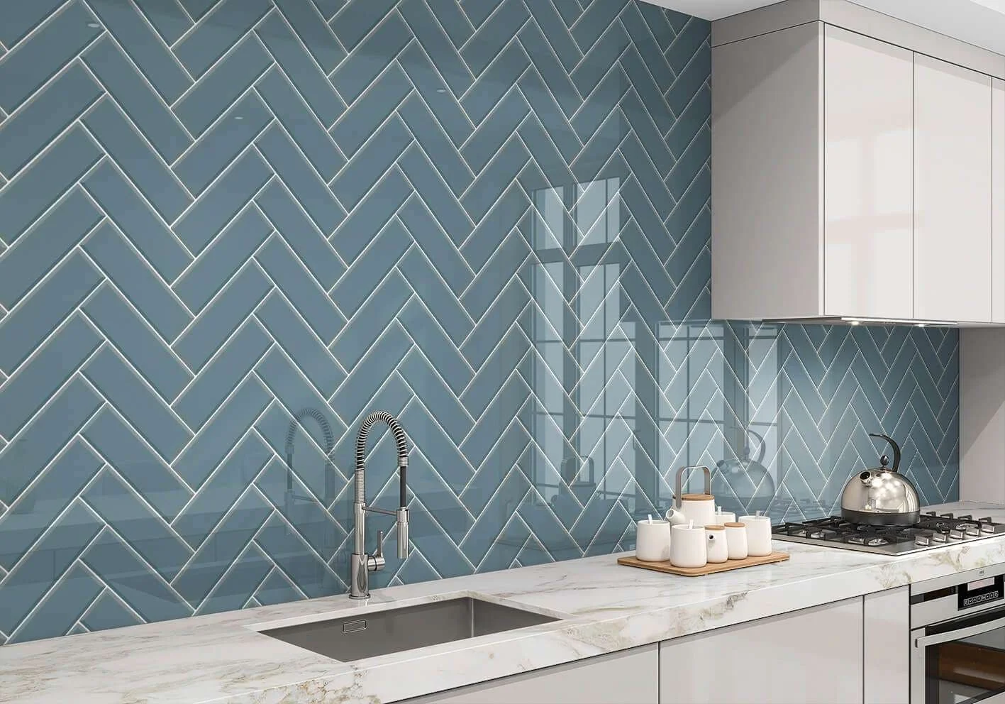 Tiled kitchen splashback with herringbone pattern